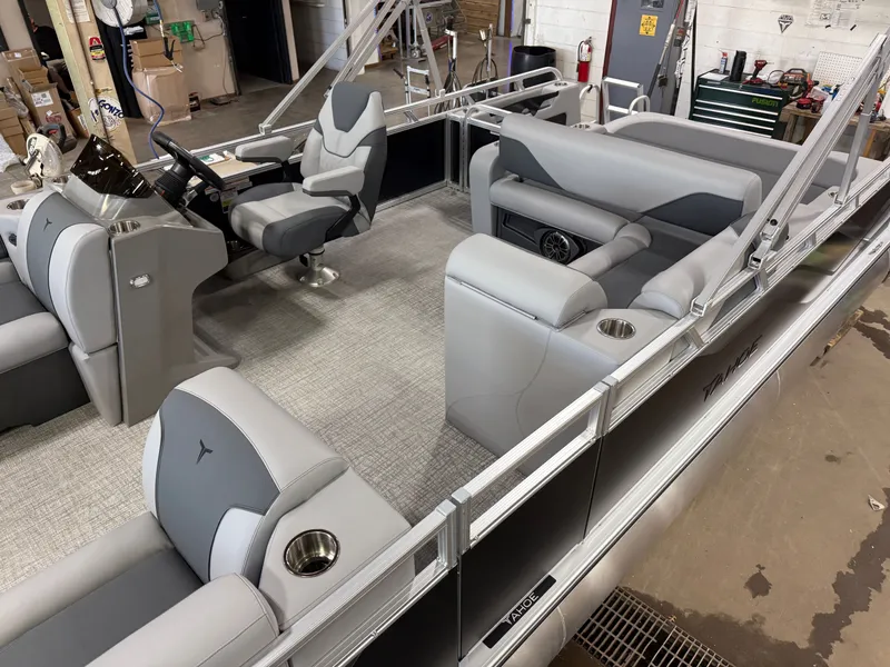 Slide: The Image of 2025 Tahoe Sport 2385 Swingback interior with Honda 4-Stroke EFI, featuring sleek seating and controls. - 3