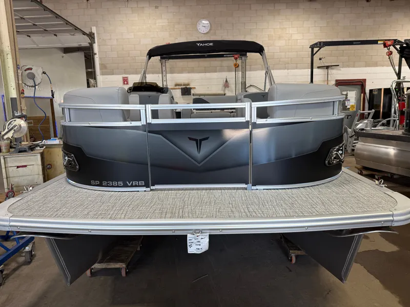 Slide: The Image of 2025 Tahoe Sport 2385 Swingback VRB boat in a workshop setting. - 32