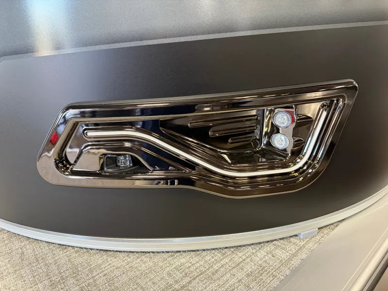 Slide: The Image of 2025 Tahoe Sport 2385 Swingback VRB boat detail with sleek chrome accents and modern design. - 33