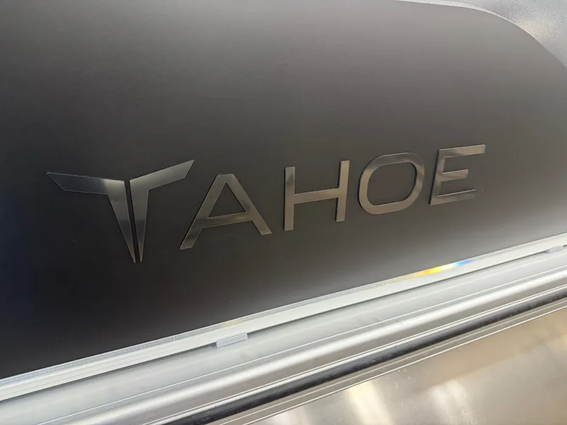Slide: The Image of 2025 Tahoe Sport 2385 Swingback logo on sleek black surface. - 36