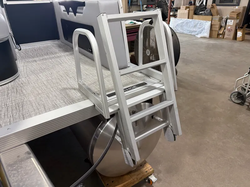 Slide: The Image of 2025 Tahoe Sport 2385 Swingback VRB boat ladder in a workshop setting. - 39