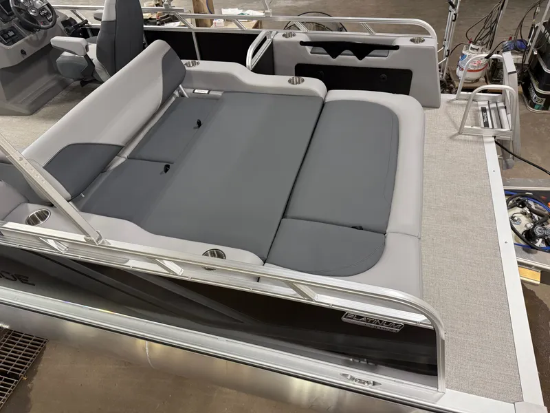 Slide: The Image of 2025 Tahoe Sport 2385 Swingback boat interior with gray seating and Honda 4-Stroke EFI engine. - 4