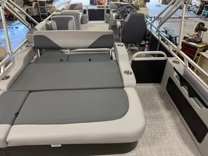 Slide: The Image of 2025 Tahoe Sport 2385 Swingback interior with gray seating and modern design. - 5