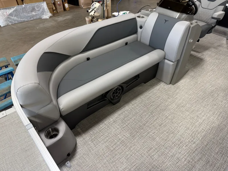 Slide: The Image of 2025 Tahoe Sport 2385 Swingback interior with gray seating and cup holder. - 7
