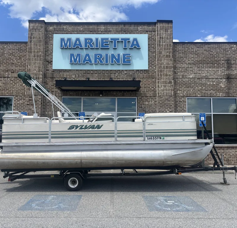 The Image of Sylvan Elite 820 w/New Tohatsu Engine and Single Axle Trailer Included 1999 - 1