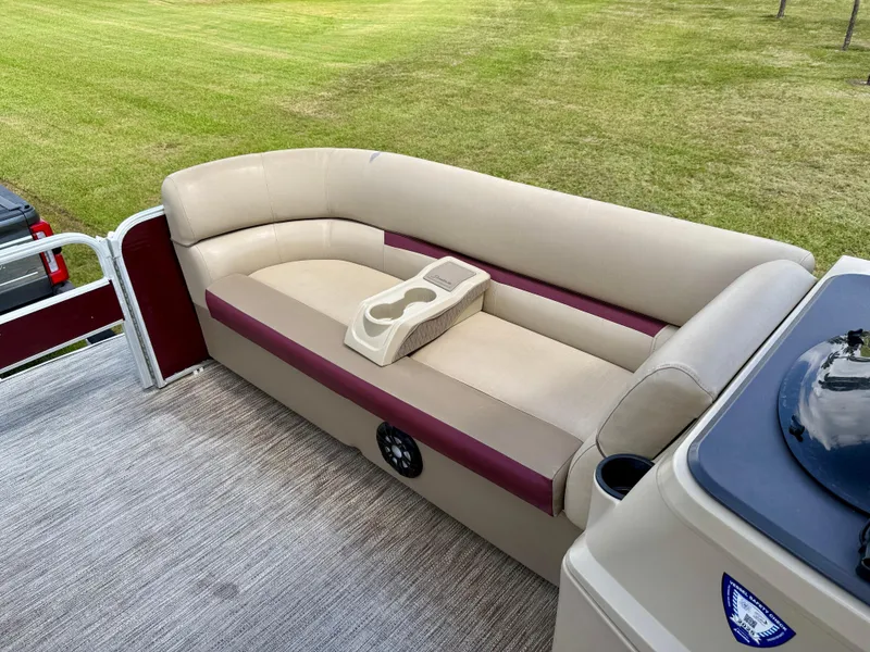 Slide: The Image of 2022 Godfrey Sweetwater 2286 C pontoon boat with beige and maroon seating, cup holders. - 16