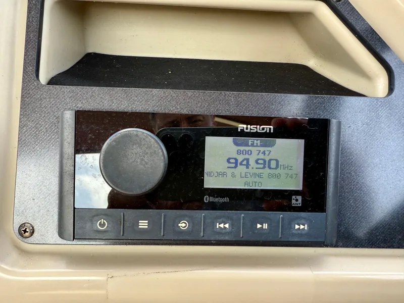 Slide: The Image of Fusion radio display on 2022 Godfrey Sweetwater 2286 C boat dashboard. - 26