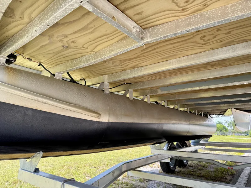 Slide: The Image of Underneath view of a 2022 Godfrey Sweetwater 2286 C pontoon boat on a trailer. - 34