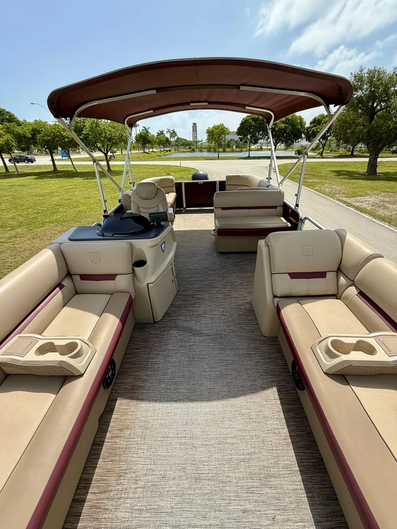 Slide: The Image of 2022 Godfrey Sweetwater 2286 C pontoon boat with spacious seating and canopy. - 8