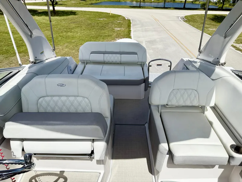 Slide: The Image of 2021 Regal 26 XO boat interior with white seating and elegant design. - 15