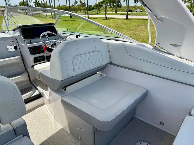 Slide: The Image of 2021 Regal 26 XO boat interior with modern helm and seating. - 16