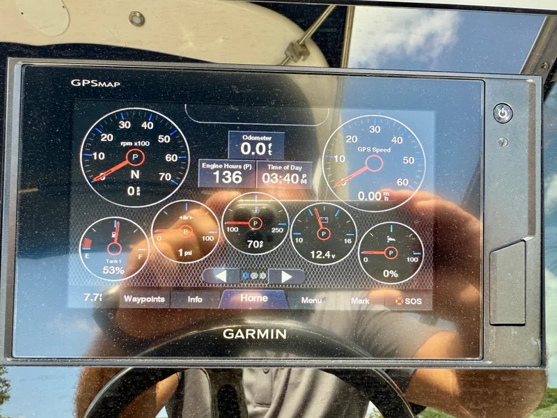 Slide: The Image of Garmin GPS display on 2021 Regal 26 XO boat showing engine and navigation data. - 21