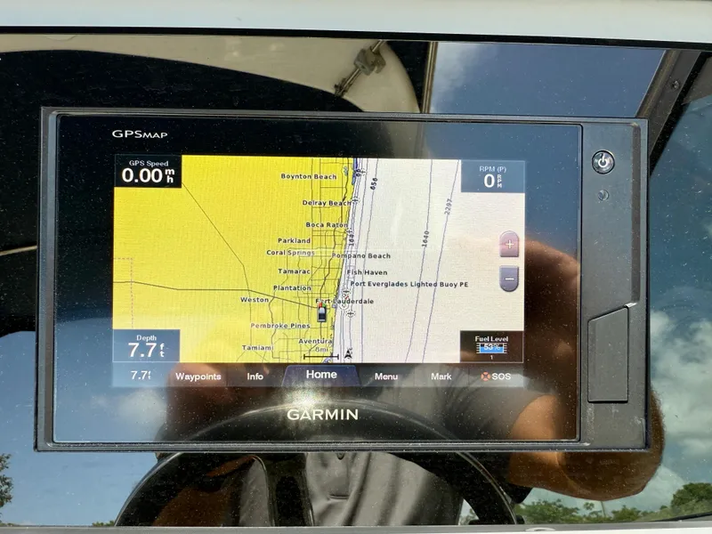 Slide: The Image of Garmin GPS display on 2021 Regal 26 XO boat, showing navigation map and data. - 23