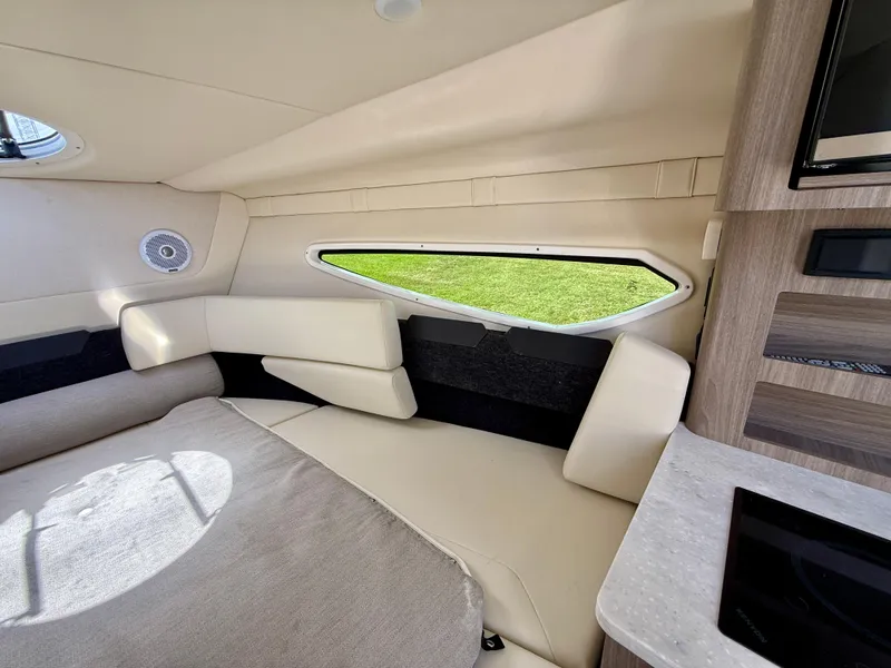 Slide: The Image of Interior of 2021 Regal 26 XO boat with beige seating and modern design. - 32