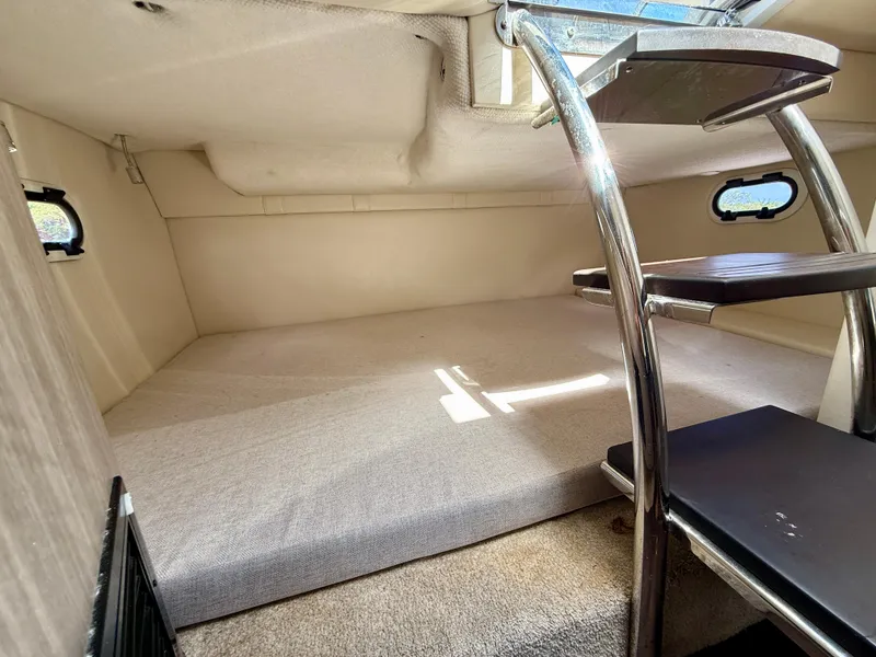 Slide: The Image of Interior cabin of 2021 Regal 26 XO boat with stairs and windows. - 33