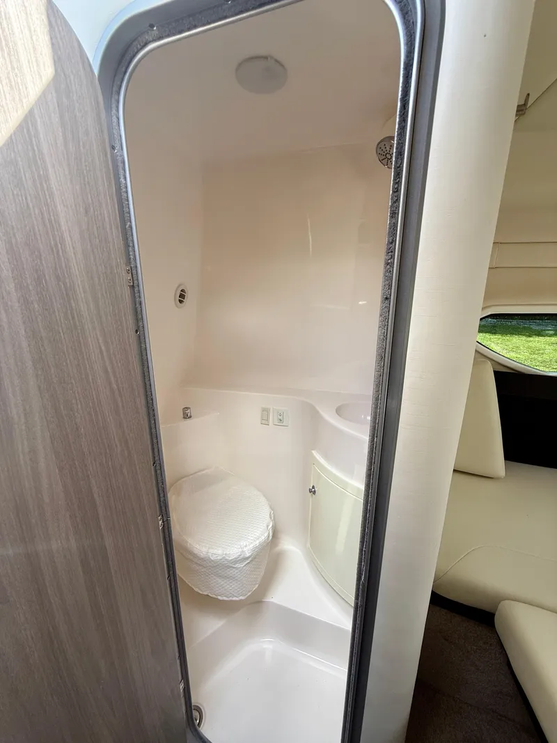 Slide: The Image of 2021 Regal 26 XO boat interior bathroom with compact design and modern fixtures. - 37