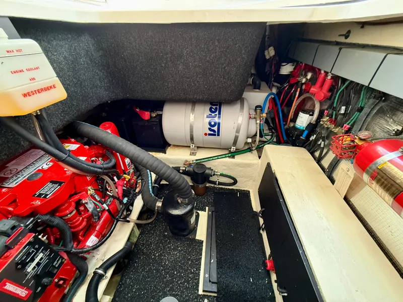 Slide: The Image of Engine compartment of a 2021 Regal 26 XO boat, featuring various mechanical components. - 46