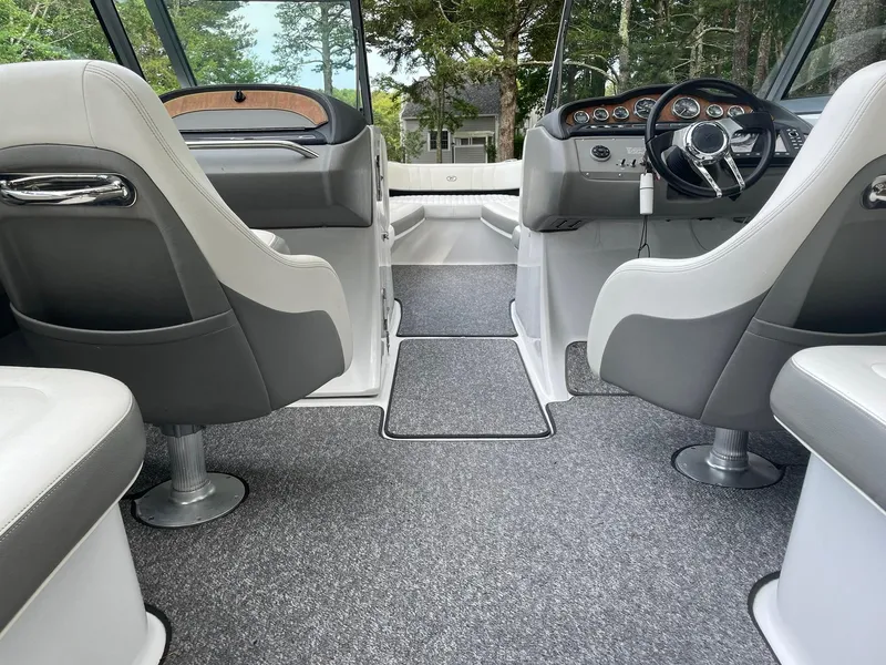 Slide: The Image of Interior of a 2010 Cobalt 262 boat with gray and white seating. - 12
