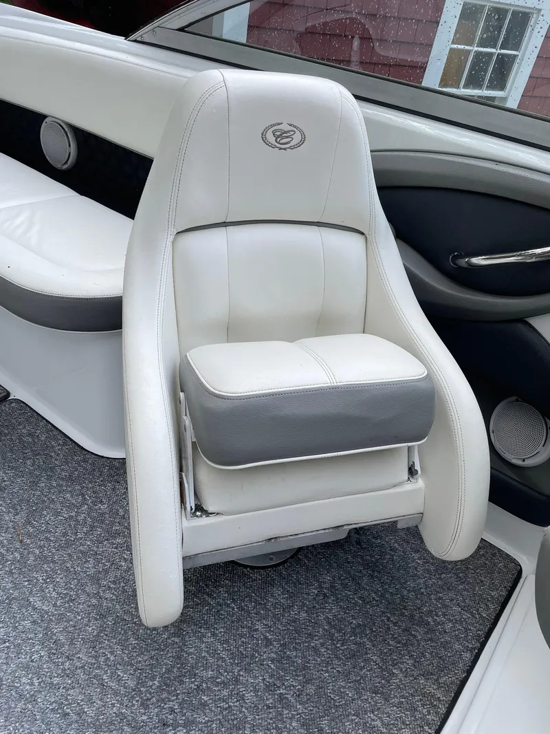 Slide: The Image of White leather seat in a 2010 Cobalt 262 boat interior. - 15