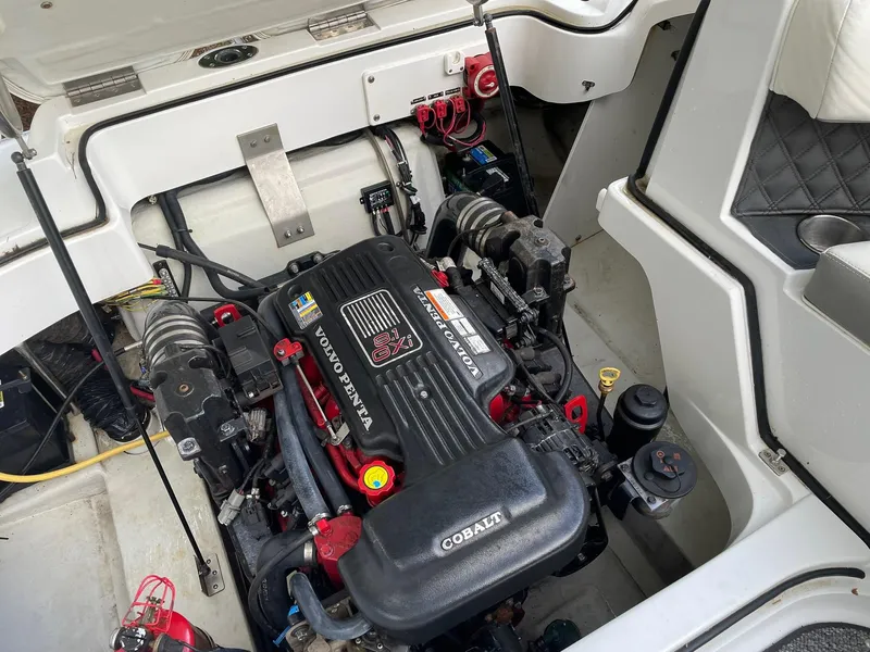 Slide: The Image of Engine compartment of a 2010 Cobalt 262 boat featuring a Volvo Penta 8.1 Gi engine. - 18