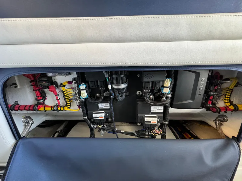 Slide: The Image of 2019 Nor-Tech 390 Sport Center Console electrical system with Garmin components and wiring. - 11
