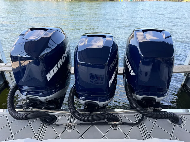 Slide: The Image of Triple Mercury outboard engines on a 2019 Nor-Tech 390 Sport Center Console boat. - 20