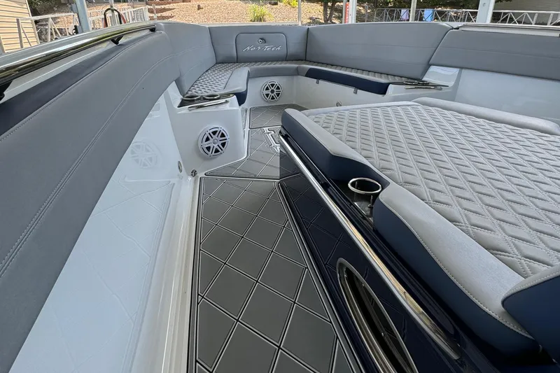 Slide: The Image of 2019 Nor-Tech 390 Sport Center Console interior with luxurious seating and sleek design. - 25
