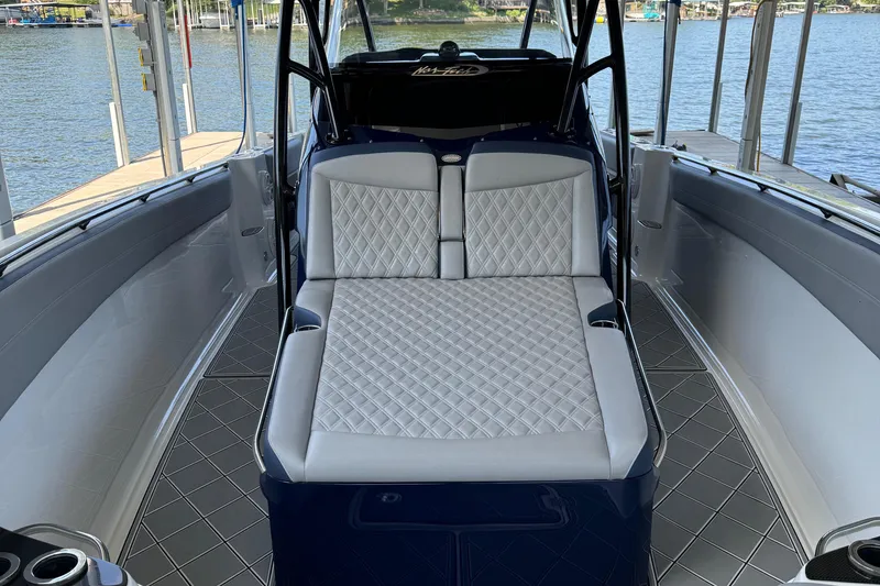 Slide: The Image of 2019 Nor-Tech 390 Sport Center Console with luxurious seating and sleek design. - 28