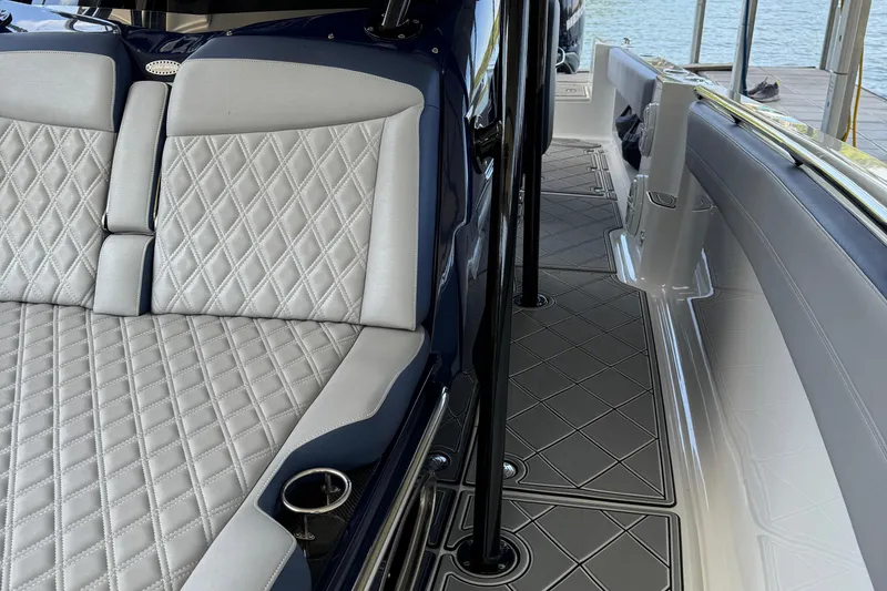 Slide: The Image of 2019 Nor-Tech 390 Sport Center Console with diamond-stitched seating and sleek deck design. - 31
