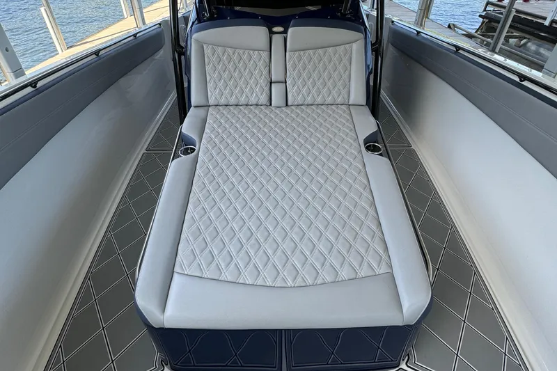 Slide: The Image of 2019 Nor-Tech 390 Sport Center Console with luxurious diamond-stitched seating. - 32
