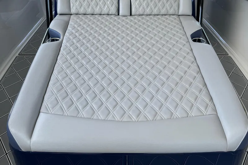 Slide: The Image of 2019 Nor-Tech 390 Sport Center Console with diamond-stitched upholstery and integrated cup holders. - 33