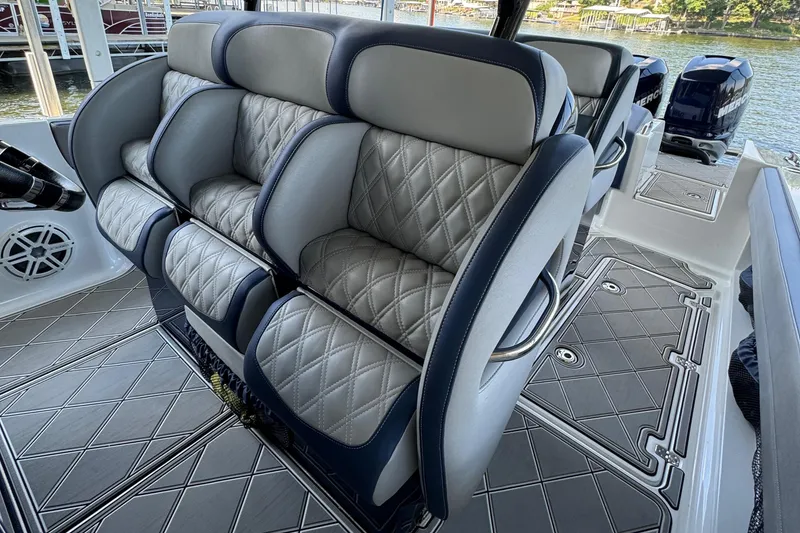 Slide: The Image of Luxurious seating on 2019 Nor-Tech 390 Sport Center Console boat with quilted upholstery. - 43