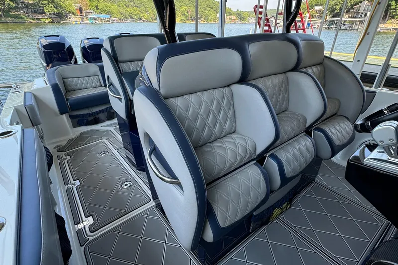 Slide: The Image of 2019 Nor-Tech 390 Sport Center Console with luxurious seating and stylish interior design. - 46