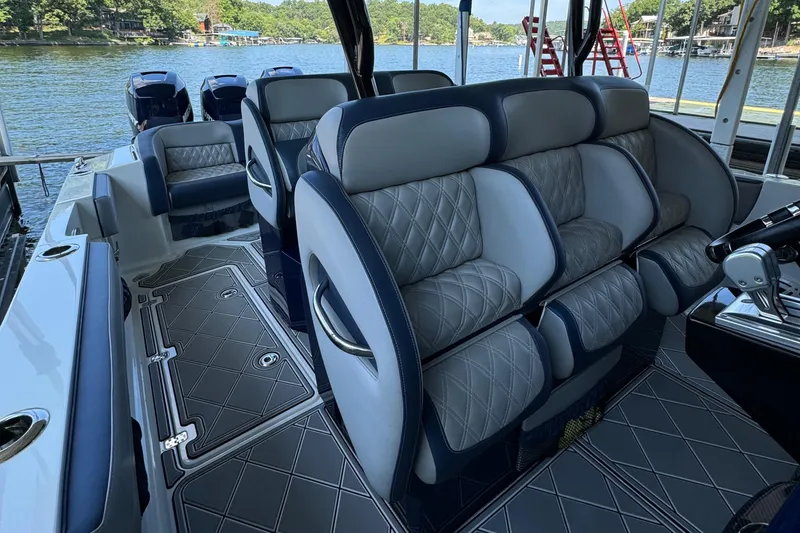 Slide: The Image of 2019 Nor-Tech 390 Sport Center Console interior with luxurious seating and lake view. - 47