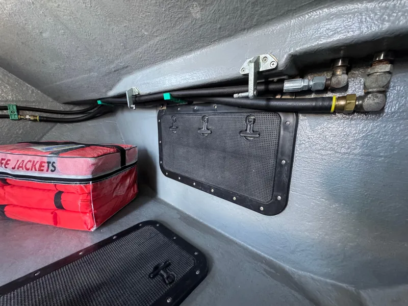 Slide: The Image of Interior of 1992 Anderson 26 boat with life jackets and secured cables. - 17