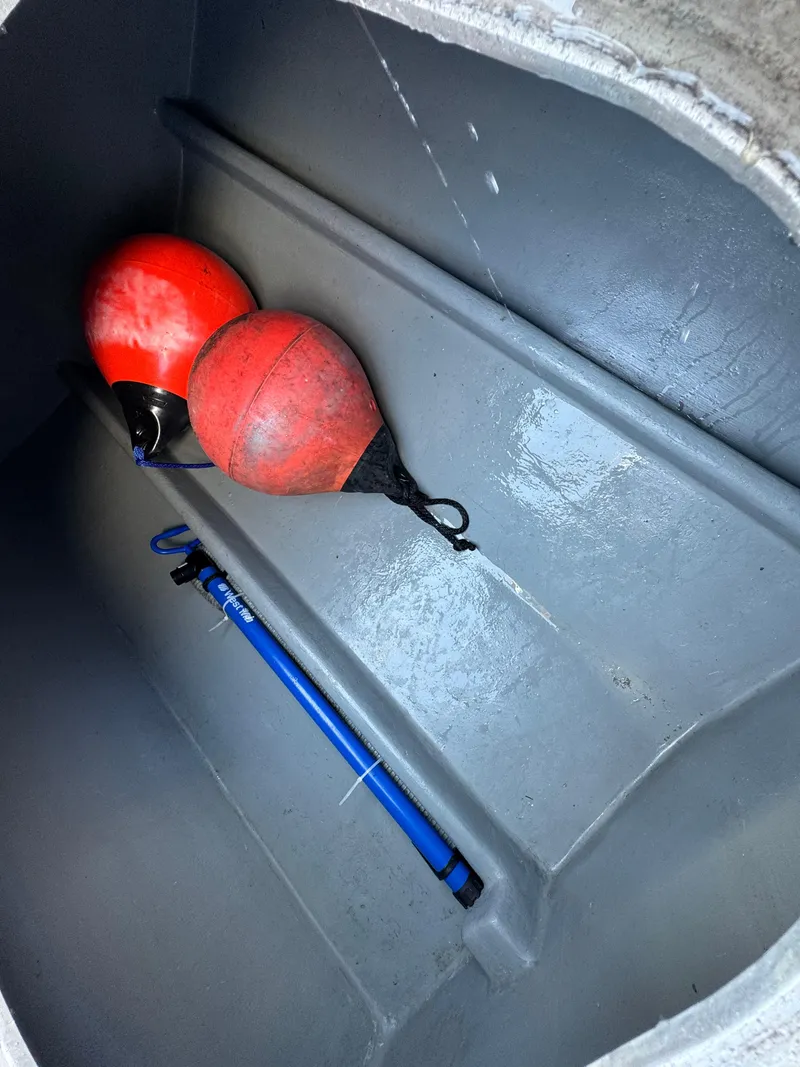Slide: The Image of Interior of Anderson 26 boat, 1992 model, with red buoys and a blue pole. - 7