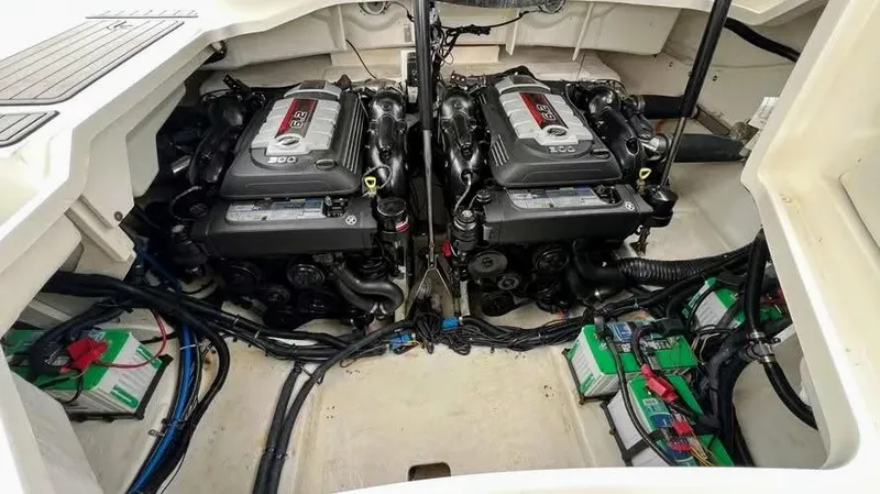 Slide: The Image of Engine compartment of a 2016 Sea Ray 310 SLX boat, featuring dual engines and batteries. - 10