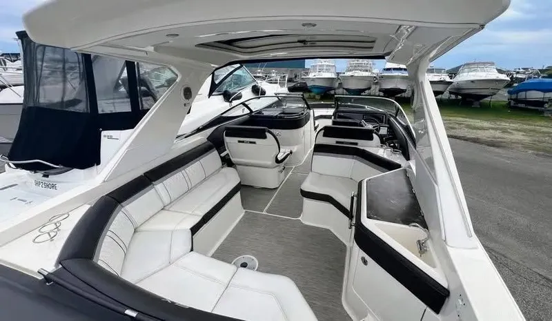 Slide: The Image of 2016 Sea Ray 310 SLX boat interior with white seating and sleek design. - 3