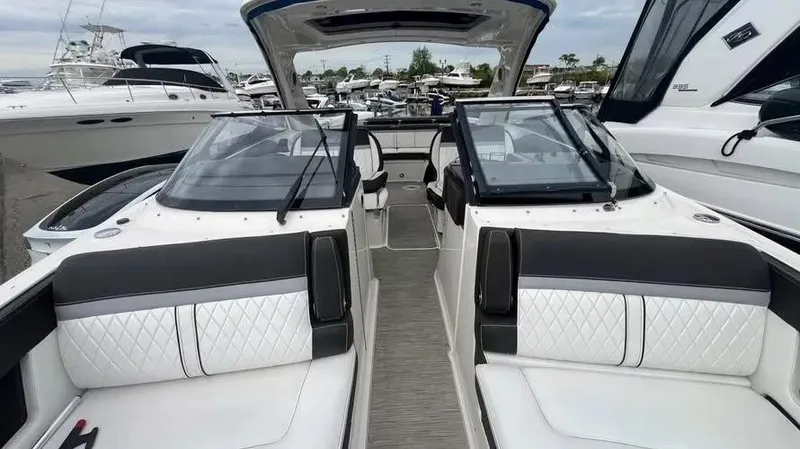 Slide: The Image of 2016 Sea Ray 310 SLX boat interior with luxurious seating and sleek design. - 6