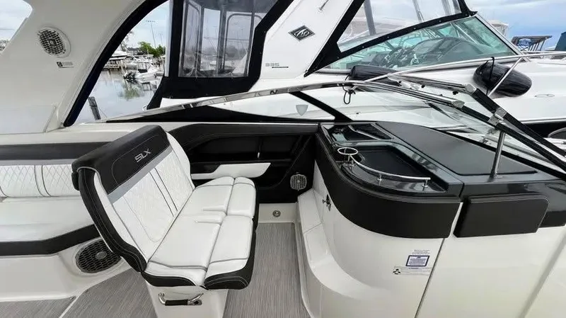 Slide: The Image of Interior of a 2016 Sea Ray 310 SLX boat, featuring sleek seating and modern design. - 8