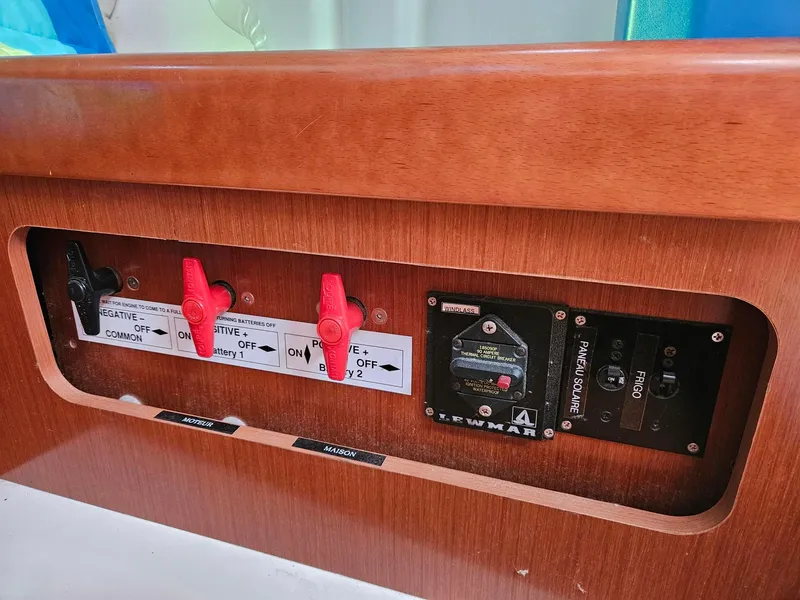Slide: The Image of Control panel of a 2012 Beneteau Oceanis 37 sailboat with switches and labels. - 26
