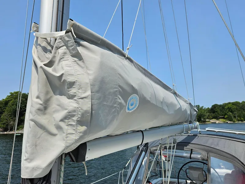 Slide: The Image of Sail cover on a 2012 Beneteau Oceanis 37 sailboat, docked on a sunny day. - 3