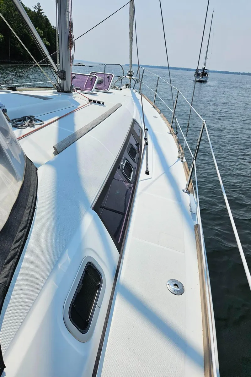 Slide: The Image of Beneteau Oceanis 37 sailboat deck, 2012 model, cruising on calm waters. - 9