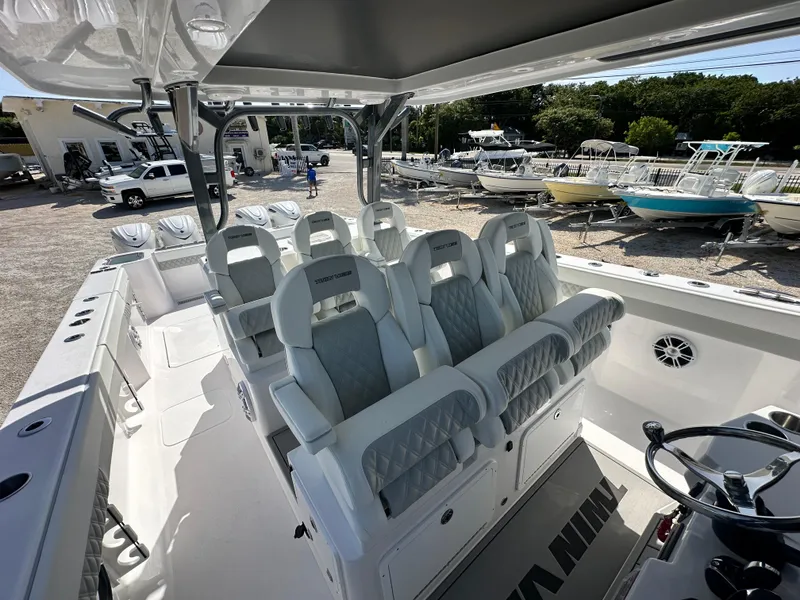 Slide: The Image of 2026 Twin Vee 400 GFX2 CC boat interior with luxurious seating and modern design. - 12