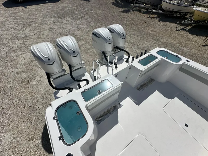 Slide: The Image of 2026 Twin Vee 400 GFX2 CC boat with four powerful outboard engines. - 27