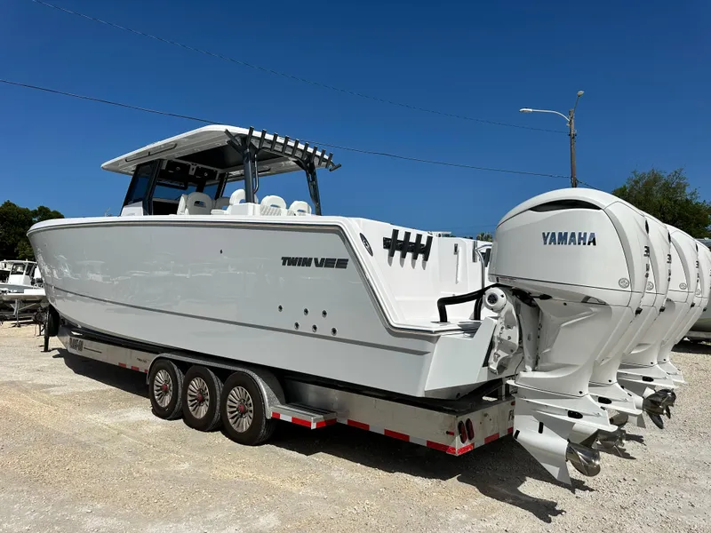 Slide: The Image of 2026 Twin Vee 400 GFX2 CC boat with Yamaha engines on a trailer. - 3