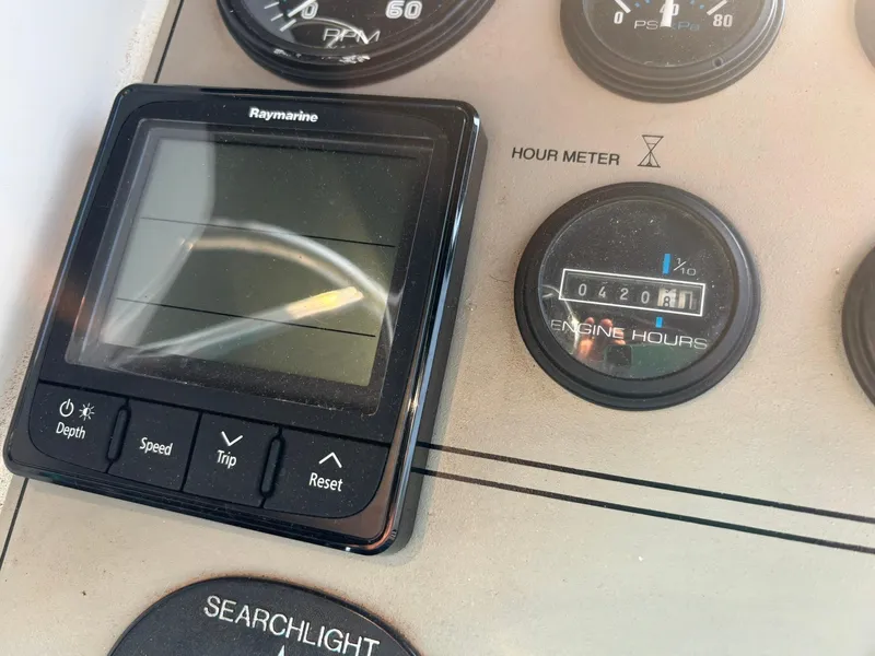 Slide: The Image of Control panel of 2000 Carver 406 Aft Cabin Motor Yacht with hour meter and Raymarine display. - 17