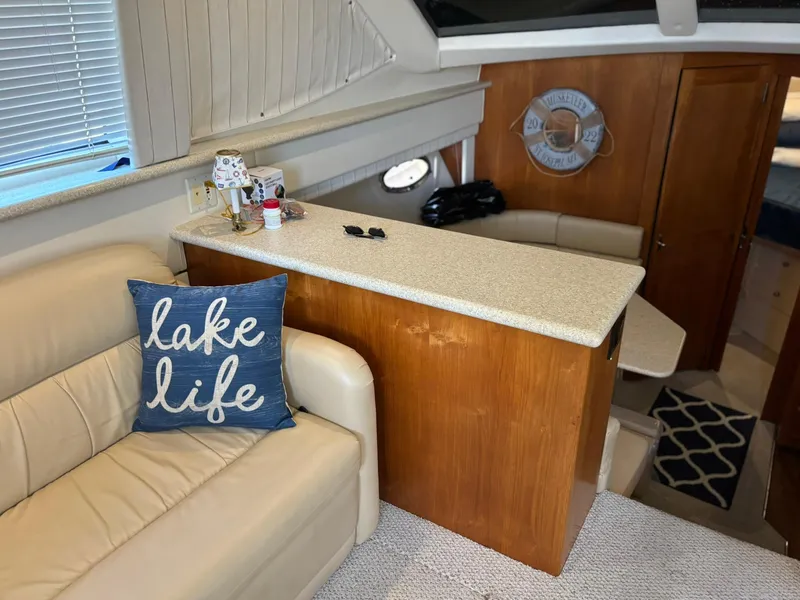 Slide: The Image of Interior of 2000 Carver 406 Aft Cabin Motor Yacht with cozy seating and nautical decor. - 23