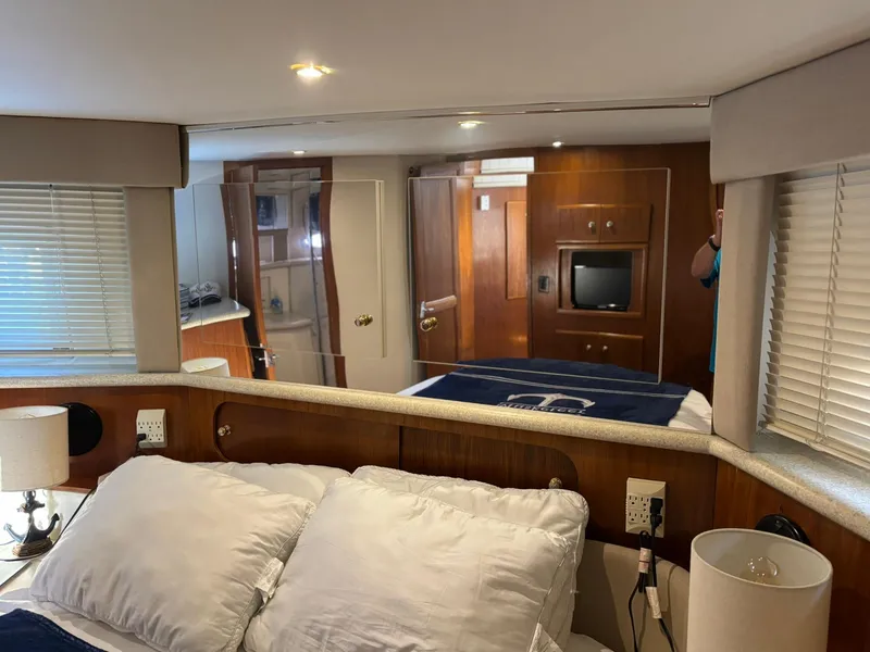 Slide: The Image of Luxurious interior of 2000 Carver 406 Aft Cabin Motor Yacht bedroom. - 39