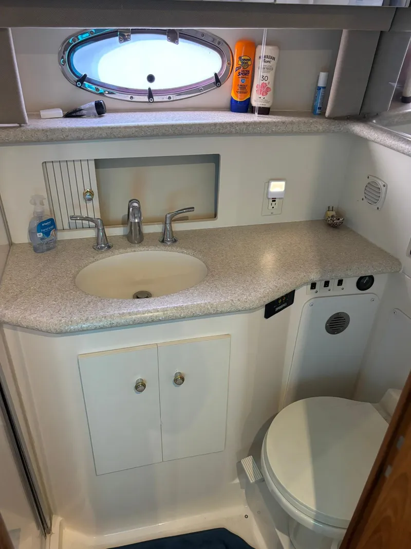 Slide: The Image of Bathroom interior of 2000 Carver 406 Aft Cabin Motor Yacht with sink and toilet. - 41